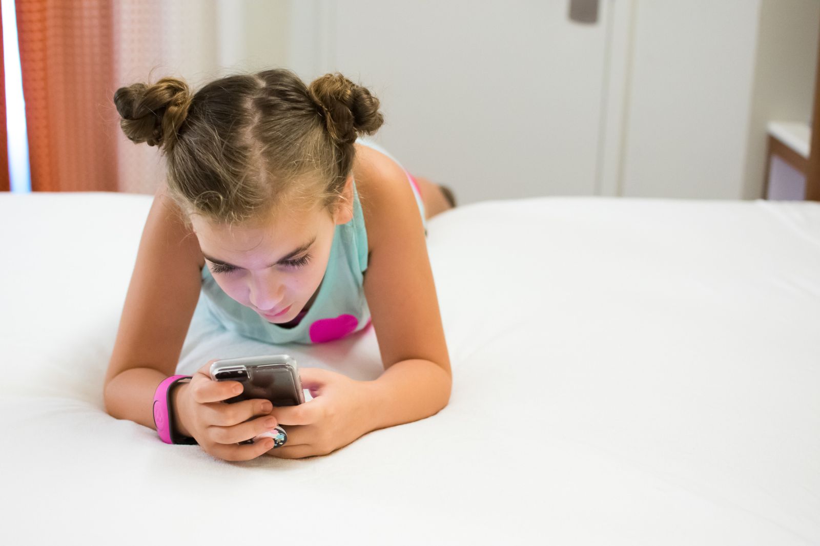 Tween girl cooling off and relaxing in her Walt Disney World Hotel Room 