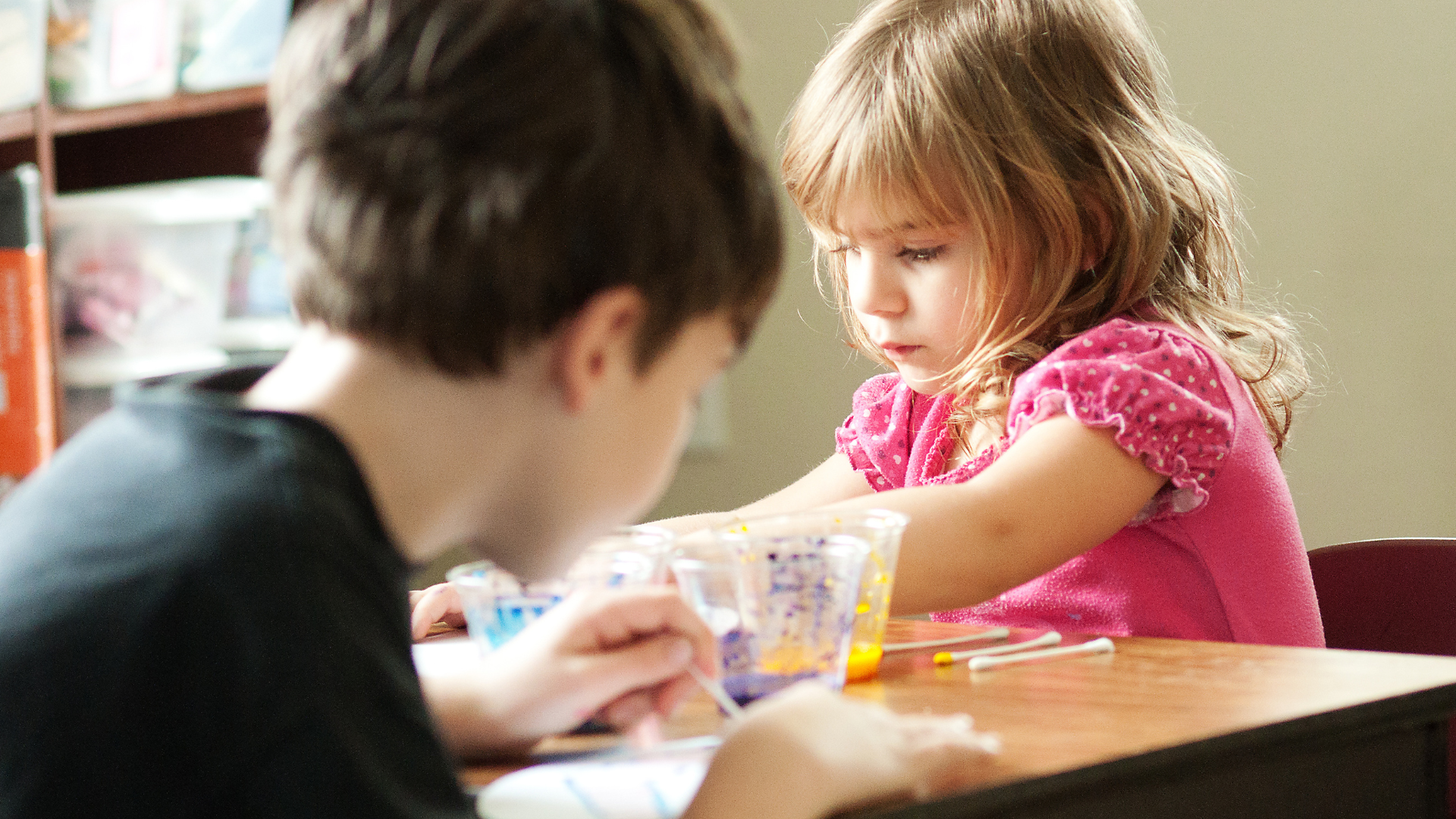 Siblingings working on an art project while homeschooling in Louisiana 