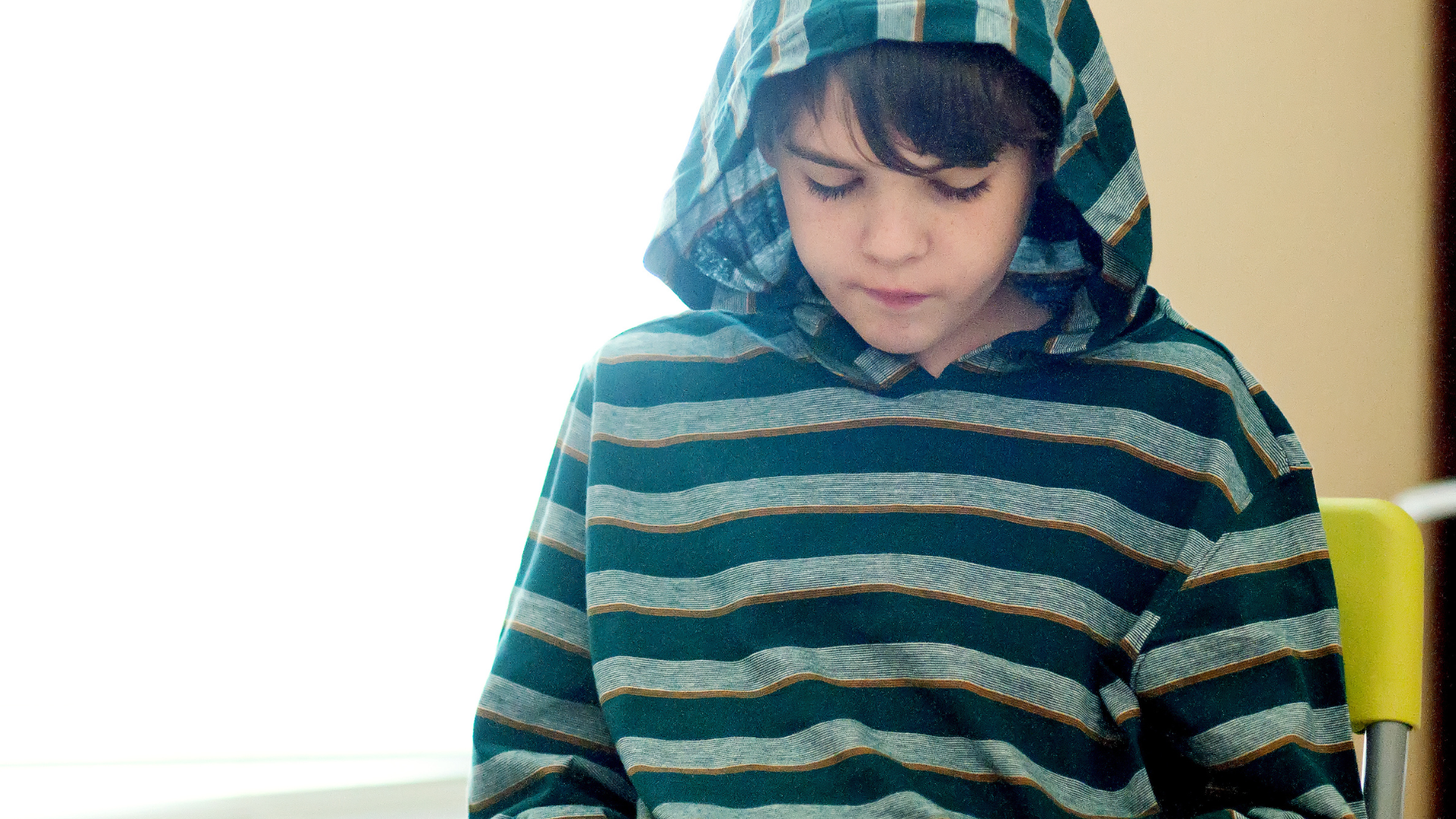 Boy reading a book while being homeschooled in Louisiana 