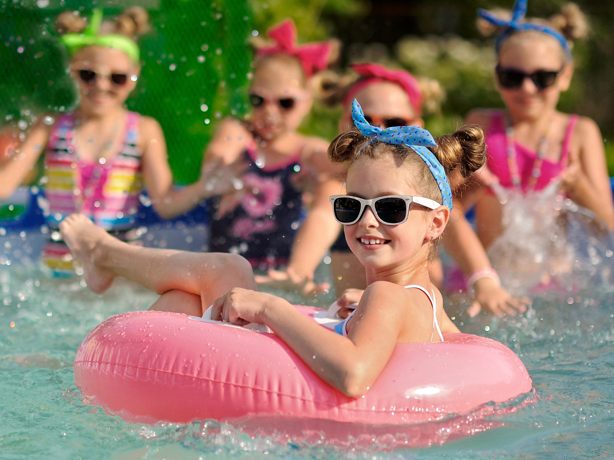 Girls swimming at an end of summer party